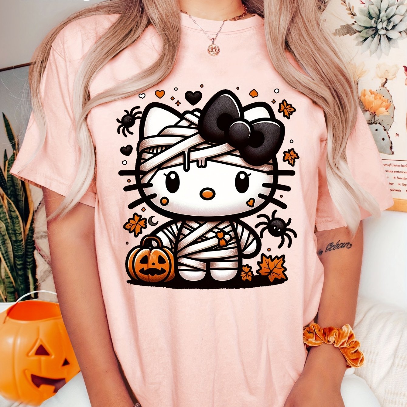 Sanrio Official Halloween Hello Kitty T-Shirt - Mummy Wrapped Graphic Tee with Orange Pumpkin, Casual Costume Party Outfit or Everyday Shirt for Women & Teens (S-XXL, Multi-Color Options) - Cute Sanrio Apparel, Halloween Clot SS69 16.69 Light Pink / XXL