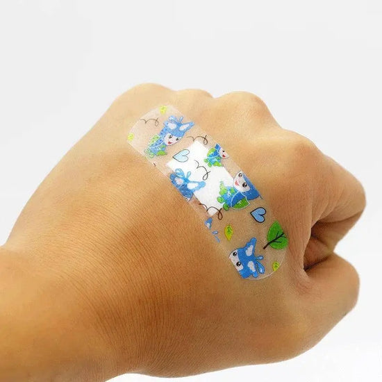 100pcs/lot Cartoon Patterned Curitas Adhesive Bandages Plaster Curved Patch Wound Strips Dressing Band Aid for Children Utensils SS69