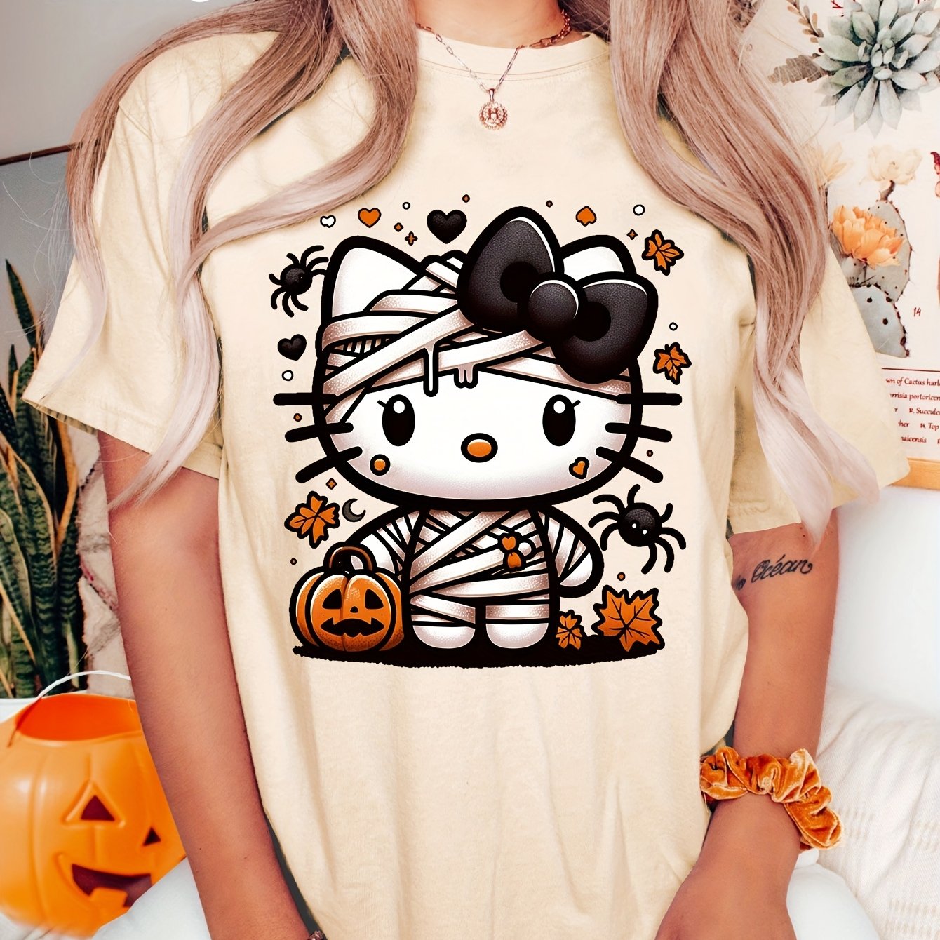 Sanrio Official Halloween Hello Kitty T-Shirt - Mummy Wrapped Graphic Tee with Orange Pumpkin, Casual Costume Party Outfit or Everyday Shirt for Women & Teens (S-XXL, Multi-Color Options) - Cute Sanrio Apparel, Halloween Clot SS69 16.69 Apricot / XXL