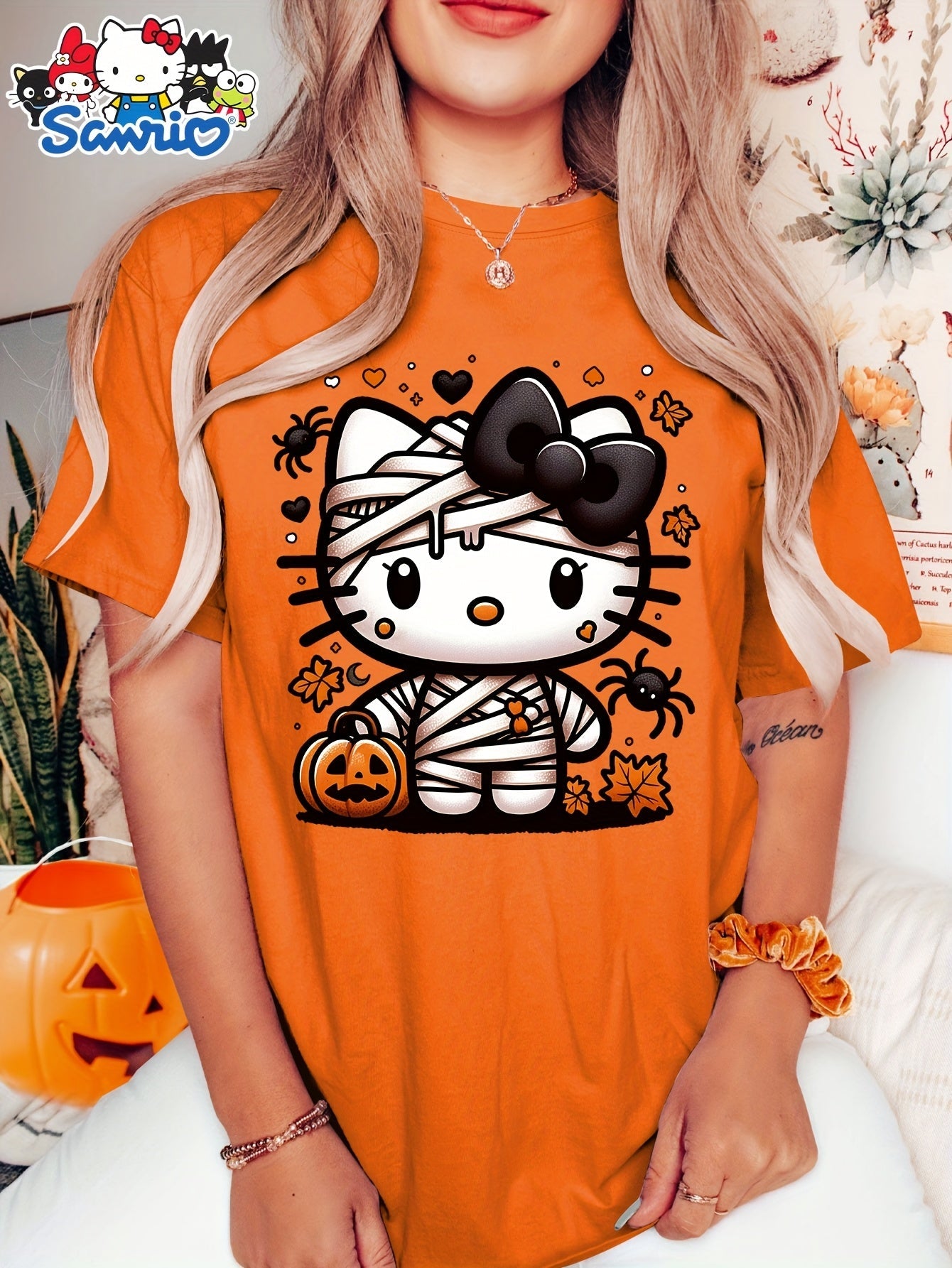 Sanrio Official Halloween Hello Kitty T-Shirt - Mummy Wrapped Graphic Tee with Orange Pumpkin, Casual Costume Party Outfit or Everyday Shirt for Women & Teens (S-XXL, Multi-Color Options) - Cute Sanrio Apparel, Halloween Clot SS69