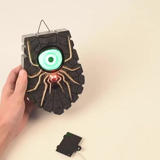 Sinister Haunted Doorbell - Luminous Ghostly Eye, Horror Sound Effects, and Animated Movement - Battery-Operated Halloween Decorative Hanging Prop for Universal, Oktoberfest, and Day of the Dead Celebrations (Requires 3 AAA B SS69