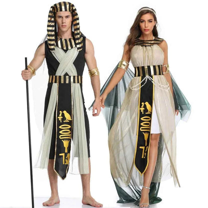 A man and woman posing in Egyptian Pharaoh and Queen costumes with gold and black accents.