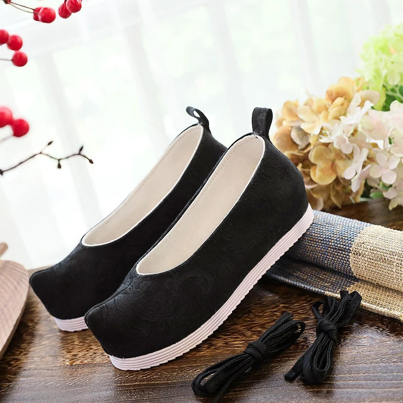 Black polyester Jinshi cosplay shoes from The Apothecary Diaries with white soles and black laces.