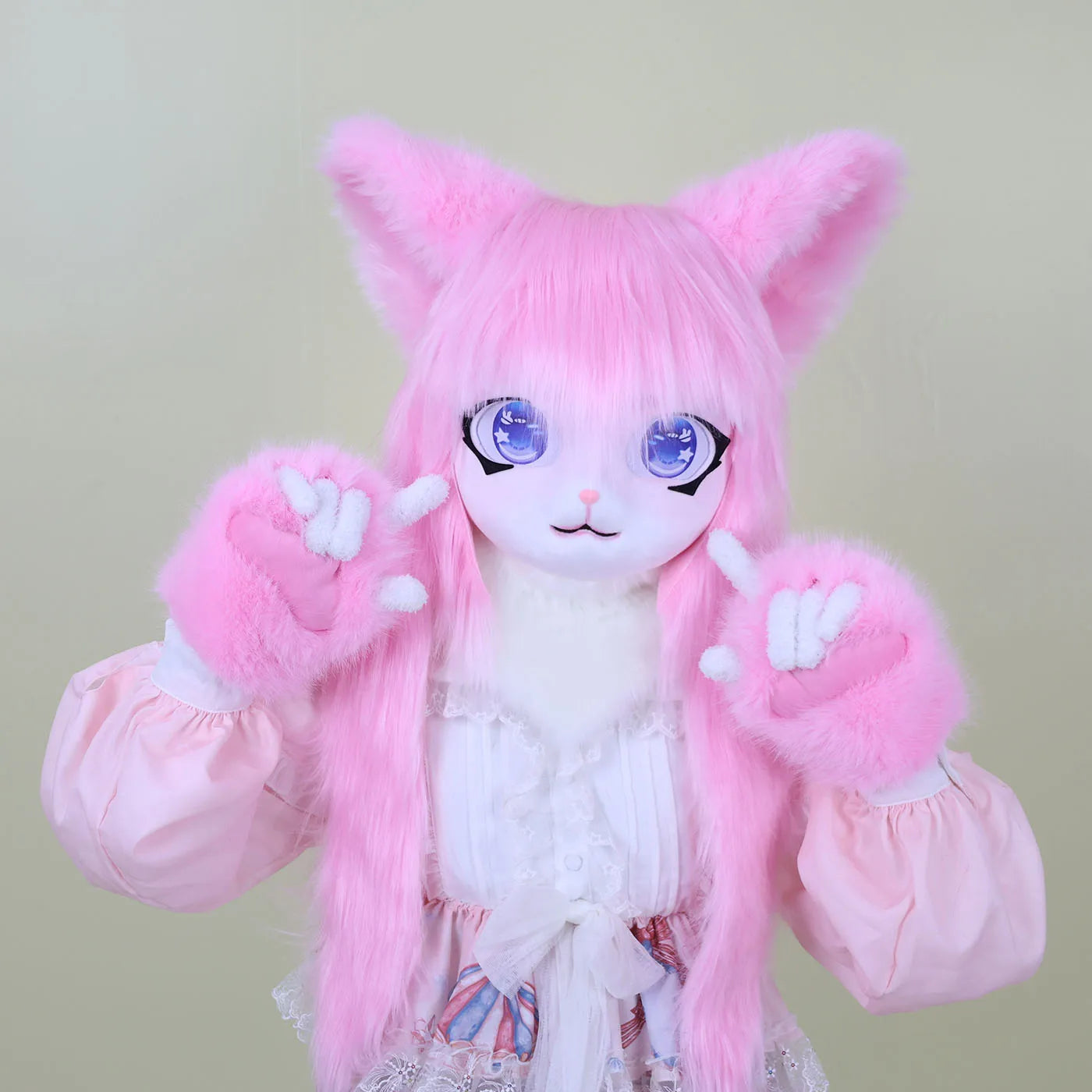 Pink furry kigurumi animal mask with large blue eyes and matching pink paws and dress.