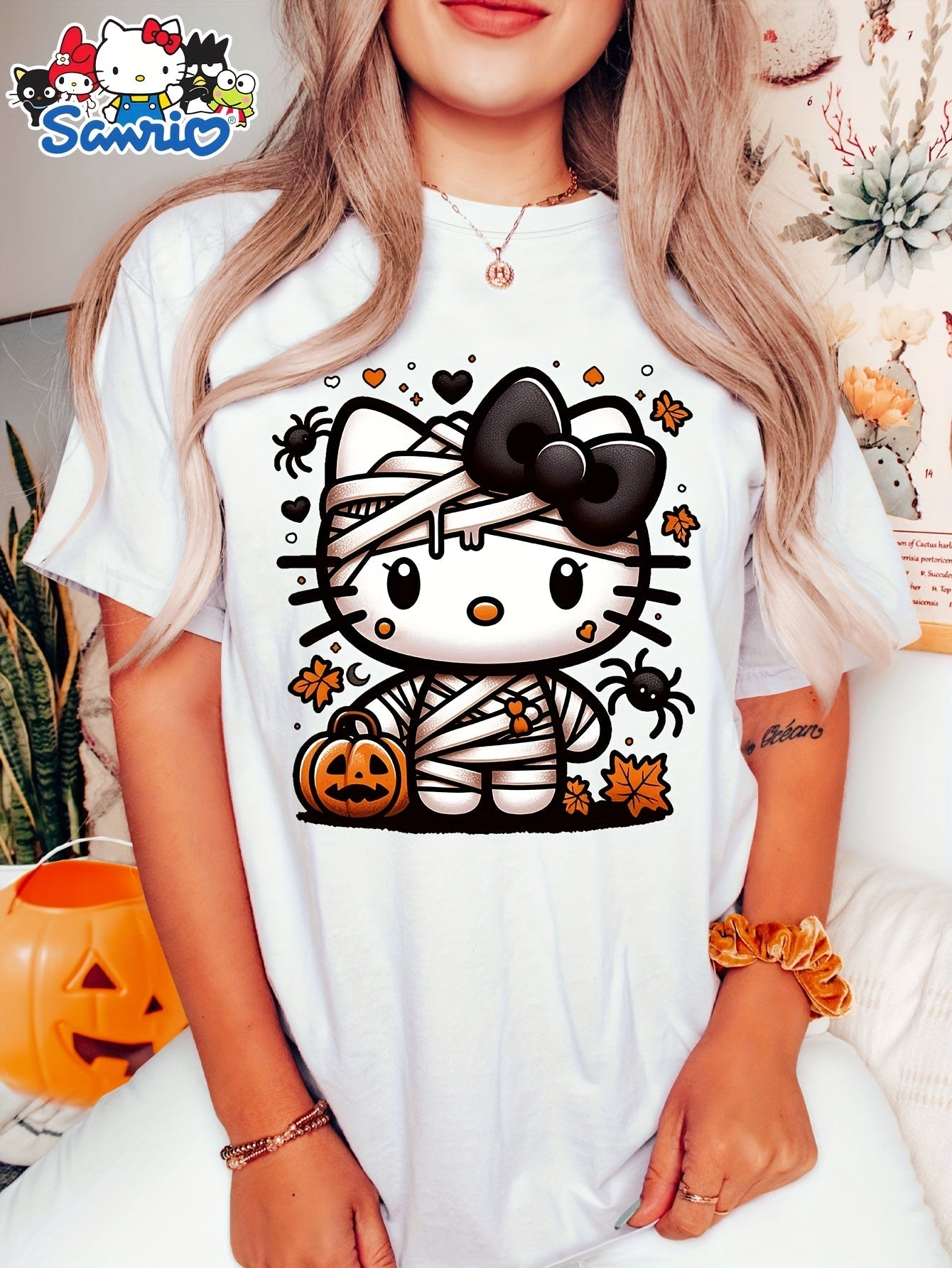 Sanrio Official Halloween Hello Kitty T-Shirt - Mummy Wrapped Graphic Tee with Orange Pumpkin, Casual Costume Party Outfit or Everyday Shirt for Women & Teens (S-XXL, Multi-Color Options) - Cute Sanrio Apparel, Halloween Clot SS69